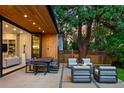 Outdoor patio area featuring comfortable seating, dining space, and a cozy fire pit at 346 Elm St, Denver, CO 80220