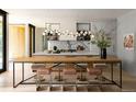 Bright open kitchen with a large center island and modern lighting fixtures, adjacent to a table at 346 Elm St, Denver, CO 80220