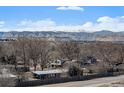 Scenic view from the property showcasing mountains and a beautiful blue sky at 8500 W 62Nd Ave # D, Arvada, CO 80004