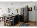 Cozy kitchen with modern appliances and a rustic center island at 1050 N Corona St # 312, Denver, CO 80218