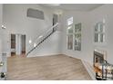 Vaulted ceilings and hardwood floors in the living room at 11127 Alcott St # A, Denver, CO 80234