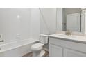 Bright bathroom featuring a tub, white tiled walls and modern vanity at 457 Interlocken Blvd # 101, Broomfield, CO 80021
