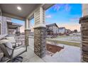 Cozy front porch with comfortable seating and a view of the neighborhood at 7257 S Millbrook Ct, Aurora, CO 80016