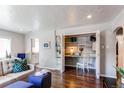 Cozy living space with a built-in desk and shelving, perfect for a home office or study area at 745 S Utica St, Denver, CO 80219