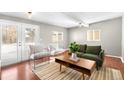 Living room with hardwood floors and access to backyard at 2610 Poplar St, Denver, CO 80207