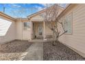 Welcoming front porch with covered entrance and landscaped front yard, offering curb appeal at 20630 E Ithaca Pl, Aurora, CO 80013
