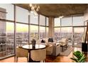 Modern living and dining area boasting city views, lots of sunlight and stylish decor at 1700 Bassett St # 2117, Denver, CO 80202