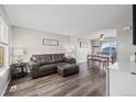 Comfortable living room flowing into a dining area, creating a warm and inviting space at 55429 E 31St Ave, Strasburg, CO 80136