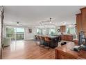Open floor plan featuring an expansive kitchen with a large central island and counter seating at 5761 W 50Th Ave, Denver, CO 80212
