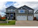 Charming home with a three-car garage and stone accents at 5895 E Conservation Dr, Frederick, CO 80504