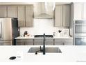 Contemporary kitchen boasts granite countertops and stainless steel appliances at 3521 Mykonos Dr, Castle Rock, CO 80109
