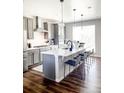 Stylish kitchen features a large island with seating and stainless appliances at 3521 Mykonos Dr, Castle Rock, CO 80109