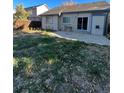 Large backyard with patio and grassy area at 4063 S Himalaya Way, Aurora, CO 80013
