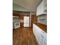 Bright kitchen featuring wood cabinets and butcher block countertops at 4063 S Himalaya Way, Aurora, CO 80013