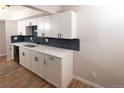 Bright updated kitchen with new cabinets, hardware and stainless steel sink at 7255 E Quincy Ave # 205, Denver, CO 80237