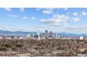 Breathtaking city skyline view with stunning mountain backdrop on a sunny day at 354 Milwaukee St, Denver, CO 80206
