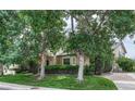 Beautifully landscaped home with mature trees and shrubs creating a private setting at 8671 E Dry Creek Rd # 721, Englewood, CO 80112