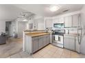 Modern kitchen with stainless steel appliances and ample cabinet space at 8671 E Dry Creek Rd # 721, Englewood, CO 80112