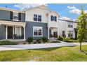 Charming two-story home featuring a welcoming front porch, attractive landscaping, and a well-maintained lawn at 8586 Holman Ct # A, Arvada, CO 80005