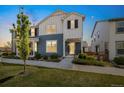 Charming two-story home featuring a combination of blue and white siding, complemented by tasteful landscaping at 8586 Holman Ct # A, Arvada, CO 80005