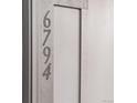 Close-up of unit address numbers at 6794 Merseyside Ln, Castle Pines, CO 80108
