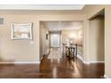 Bright and spacious entryway with hardwood floors and elegant mirror at 12551 Tamarac St, Thornton, CO 80602