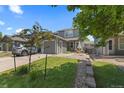 Charming home features a well-maintained front yard, inviting walkway and a two-car garage at 11062 Gaylord St, Northglenn, CO 80233