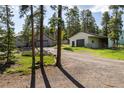 Exterior view featuring a home and a garage with a driveway, showcasing ample parking space at 1194 Camp Eden Rd, Golden, CO 80403