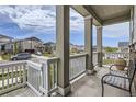 Inviting front porch with bench seating, offering a relaxing outdoor space at 9227 Salida St, Commerce City, CO 80022