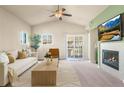 Bright living room boasts a fireplace, sliding glass doors, and neutral tones, perfect for relaxation and entertaining at 6202 Kilmer Loop # 202, Golden, CO 80403