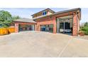 Spacious garage with multiple bays and ample parking for vehicles and trailers at 5925 Zinnia Ct, Arvada, CO 80004