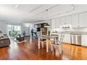 Bright living room featuring hardwood floors and combined living/dining and kitchen at 3465 S Poplar St # 506, Denver, CO 80224