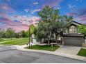 Spacious corner lot features a charming two-story home with an attached garage and well-maintained lawn at 4112 Brandon Ave, Broomfield, CO 80020