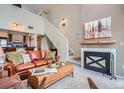 Inviting living room featuring a fireplace, a comfortable leather sofa and view into the kitchen at 3260 47Th St # 205A, Boulder, CO 80301