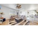 A lovely, well-lit living room with nice furniture at 13488 Wabash St, Thornton, CO 80602