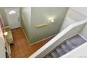 Bright foyer with tile flooring, staircase to the second floor, and a bench seat at 6292 Kilmer Loop # 201, Golden, CO 80403