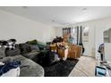 Spacious living room with a cozy couch and lots of natural light perfect for relaxing at 5721 W 92Nd Ave # 53, Westminster, CO 80031
