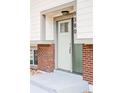 A close up of the home's front door featuring a modern design and the house number 9380 at 9380 Raleigh Ct, Westminster, CO 80031