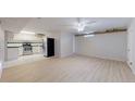 Living room view of bright, efficient kitchen with stainless steel appliances at 505 N Logan St # 14, Denver, CO 80203