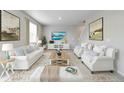 Elegant living room featuring modern decor, plush seating, and bright natural light at 1898 Westport Ave, Berthoud, CO 80513