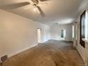 Bright living room featuring a ceiling fan at 4159 Wyandot St, Denver, CO 80211