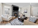 Living room with a fireplace and large windows at 138 Lullaby Ln, Castle Rock, CO 80109