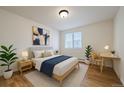 Cozy bedroom with a comfortable bed, modern desk, and bright window for ample natural light at 5402 Carr St # 307, Arvada, CO 80002