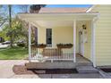 Charming front porch with white railings, decorative planters, and a welcoming entrance to the home at 3333 W Hayward Pl, Denver, CO 80211