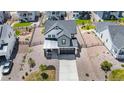 Aerial view of a home with a well-manicured yard and a two-car garage at 1168 Elbridge Dr, Elizabeth, CO 80107