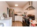 Updated kitchen features stainless steel appliances, white cabinets, and plenty of counter space at 6800 E Tennessee Ave # 461, Denver, CO 80224