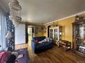 Bright living room featuring hardwood floors and eclectic decorations at 260 Sheridan Blvd, Denver, CO 80226