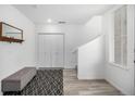 Entryway with closet, bench, rug and stairs at 1342 Independence St # 6, Lakewood, CO 80215