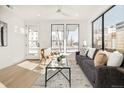 Bright living room with large windows and comfortable seating at 273 S Jackson St, Denver, CO 80209