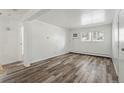 Bright living room with luxury vinyl floors, window, and a neutral palette at 5995 W Hampden Ave # 3I, Denver, CO 80227